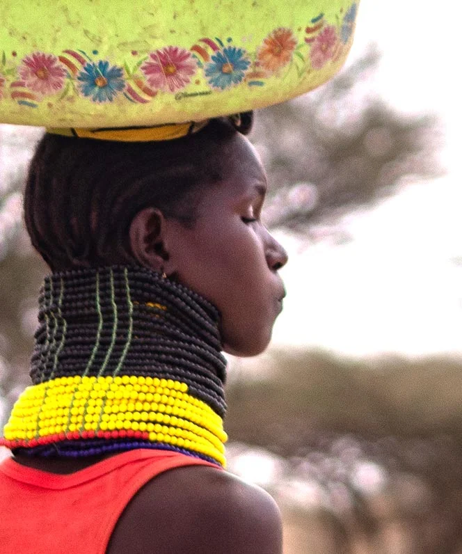 young woman with load on her head